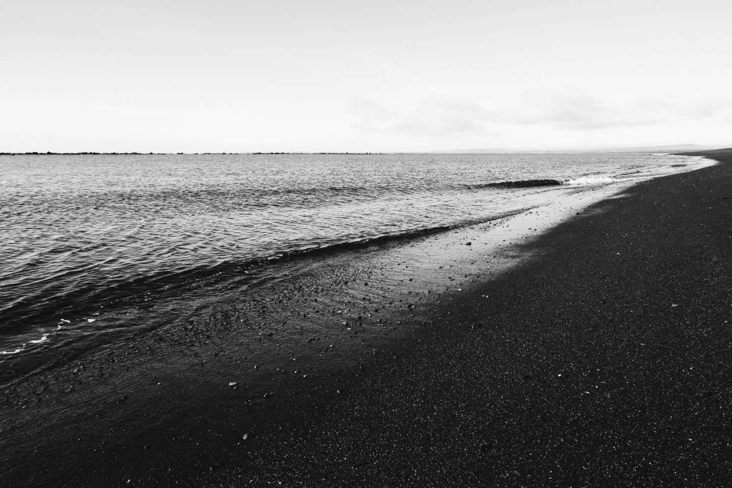 Black sand and surf at Óseyrartangi